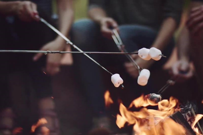 Toasting marshmallows over a roring fire